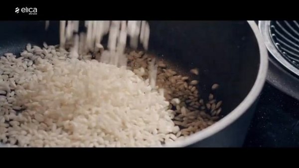 Induction cooktop with a fully integrated extraction system