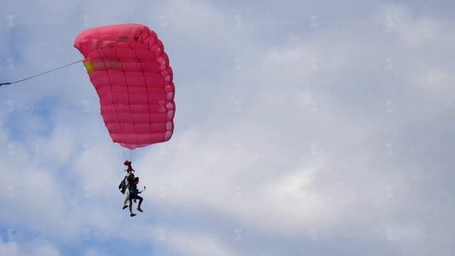 Two people flying Paraglider against clear blue sky. Paragliding Tandem. Extreme sport. смотреть онлайн