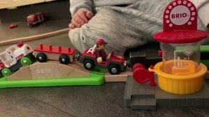 Максим играет с поездом и  деревянной железной дорогой  BRIO