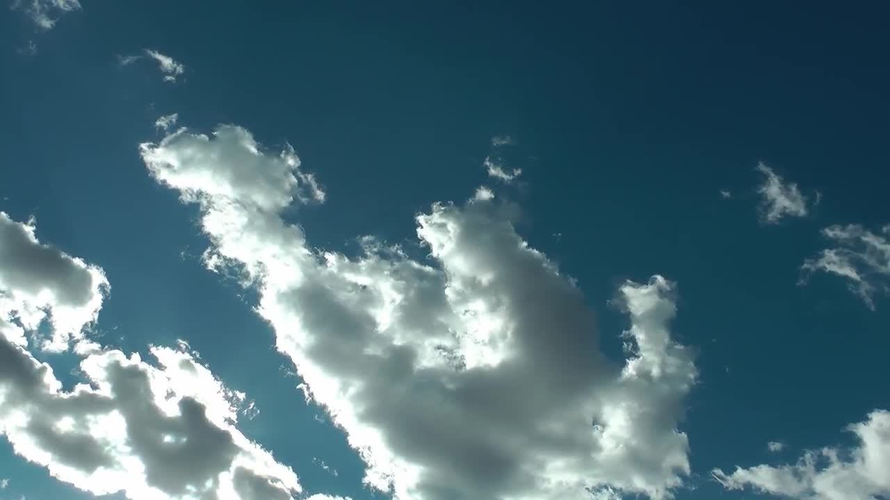 Sun Leaks Through Rain Clouds Stock Video смотреть онлайн