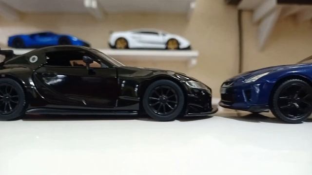 Nissan GTR by RMZ CITY and TOYOTA GR SUPRA RACING CONCEPT by Kinsmart close up view of diecast car смотреть онлайн