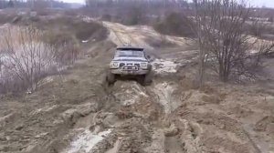 Nissan Patrol Y60 4 2D off road in mud