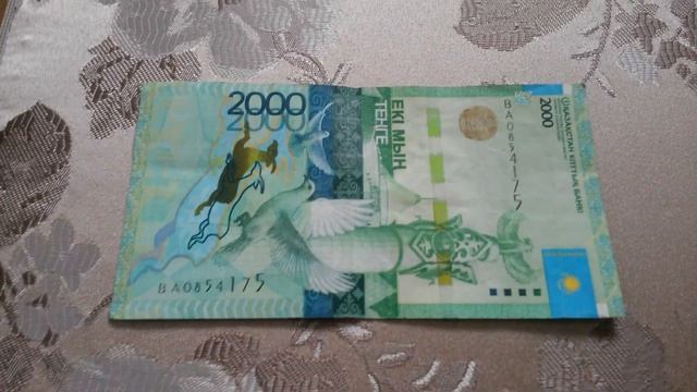 БАНКНОТА 2000 ТЕНГЕ № серии ВА0854175 на парчовой поверхности Пятнадцатого Марта - ДЕНЕЖНЫЙ ПОТОК смотреть онлайн
