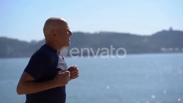 Focused Mature Man Running at Riverside | Stock Footage - Envato elements смотреть онлайн