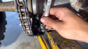 How to tighten the chain on a Yamaha raptor 350. #6