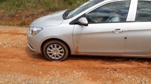 Sexy girl in the mud stuck in high heels boot, and pedal pumping