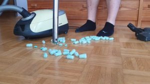 Vacuuming up styrofoam