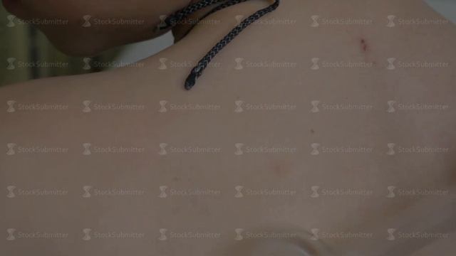 Medical procedure darsonvalization close-up. Child uses darsonval for massage head's skin. Receivin смотреть онлайн