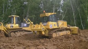 Бульдозеры John Deere 750J и Komatsu D65E