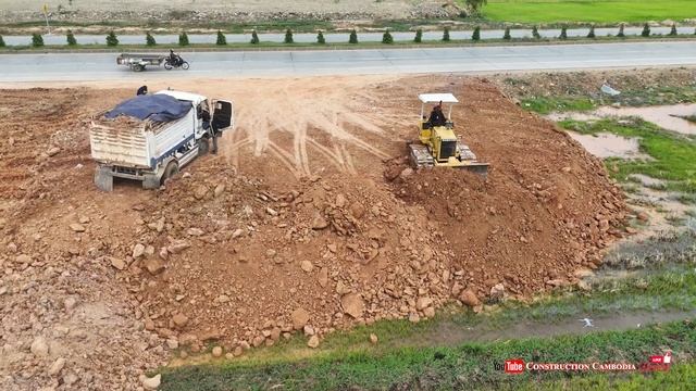 Wonderful Landfill Side Road Best Mini Dump Trucks Unloading Soil And Dozer Pushing Soil Into Water