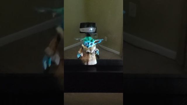 Baby Yoda Grogu Star Wars Hologram Projected Onto Vapor From A Fog Machine смотреть онлайн