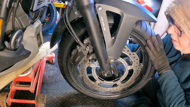 Honda NC750x DCT Removing Wheels & Replacing Brake Pads