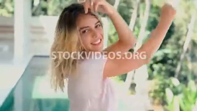 young beautiful woman posing for camera,... смотреть онлайн