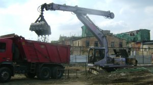 Экскаватор Cat 325B L с телескопической рукоятью