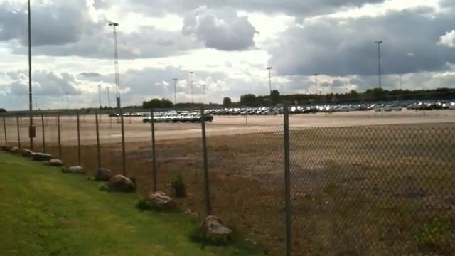 Empty parkings outside the SAAB factory смотреть онлайн