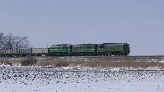 Long train among winter plowed fields смотреть онлайн