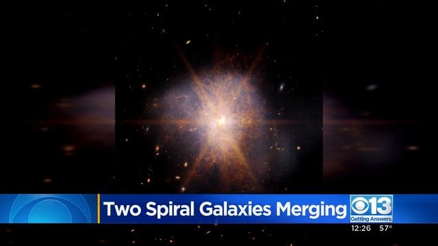 NASA releases image of 2 spiral galaxies merging in "enormous burst" 250 million light-years away смотреть онлайн