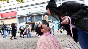 Girl spits in guys mouth on a public street