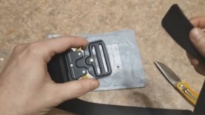 распаковка: ремень с пряжкой кобра