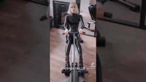 Rowing exercises in a latex suit