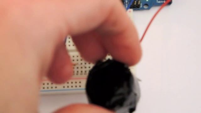 Arduino connected to a photoresistor and a piezo buzzer смотреть онлайн