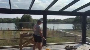 HUUN автоматическая система безрамного остекления