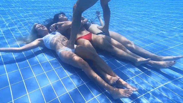 3 Girls Breath Hold Unerwater At The Bottom Of Swimming Pool (experimental)