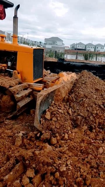 Bulldozer pushing the stone on the road Construction. #bulldozer #dumptruck смотреть онлайн