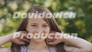 Funny teen girl posing in front of camera and showing her long luxurious long hair