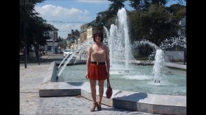 Crossdresser in public with red pleated mini skirt and high heels