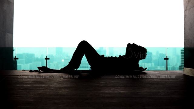 Silhouette of a man pumping his abs on the background of the megapolis смотреть онлайн