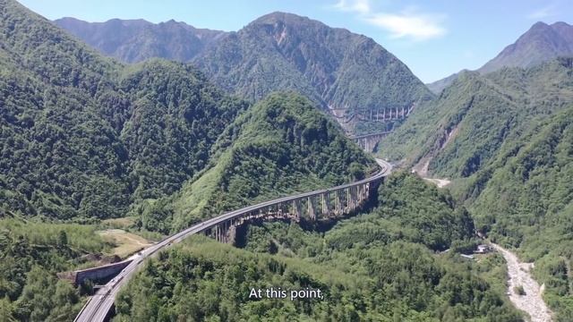 Aerial China The high speed Qianhaizi Double Helix Bridge on the cloud in China смотреть онлайн