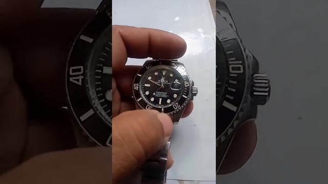 ROLEX  OYSTER PERPETUAL DATE SUBMARINER 1000 Ft-300m SUPERLATIVE CHRONOMETER OFFICIALLY CERTIFIED.