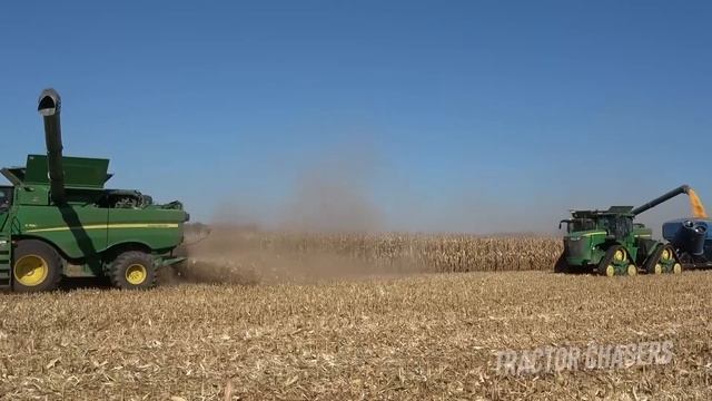 Two John Deere S780 Combines Harvesting Corn With John Deere Tractors