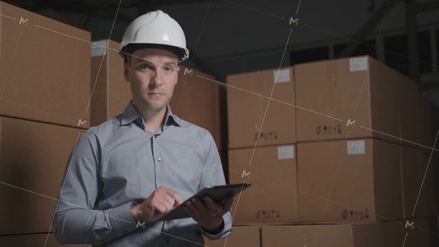 Man In A Helmet Makes An Audit In A Warehouse Using A Tablet.
