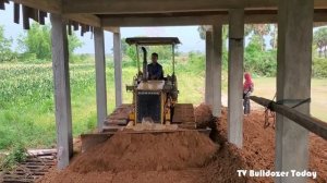 Komatsu D20P Dozer will have 5 tons of trucks pushing the ground under the house