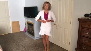 Crossdresser in White Business Suit