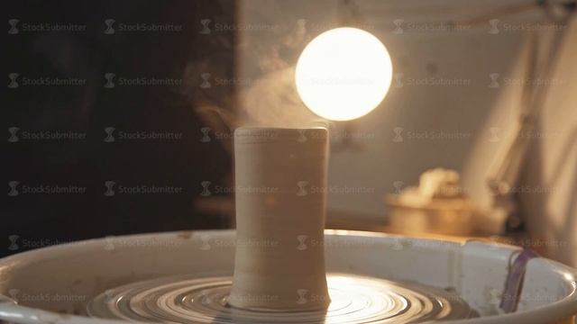 Pottery studio - clay ware on the potter's wheel, dark background смотреть онлайн