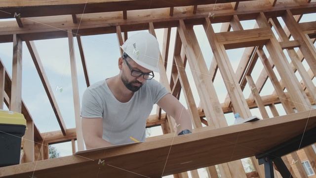 Architect Inspects A House Under Construction, Camera Slowly Rotating.