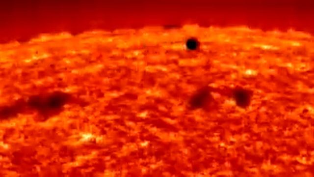 SOHO-EIT He II movie showing the transit of Mercury, which occurred in 1999. смотреть онлайн
