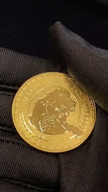 Золотая монета "Лев и Орел" 2024 г. 31,1 г ч. золота. Великобритания смотреть онлайн