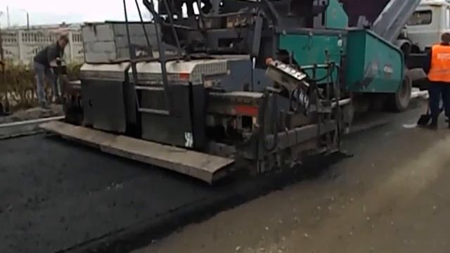 Влаштування нижнього шару покриття з крупнозернистого асфальтобетону по вул. Набережна