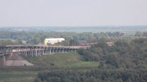 Электропоезд ЭД9Т-0019 и ЭД9М-0030. Встреча на мосту.