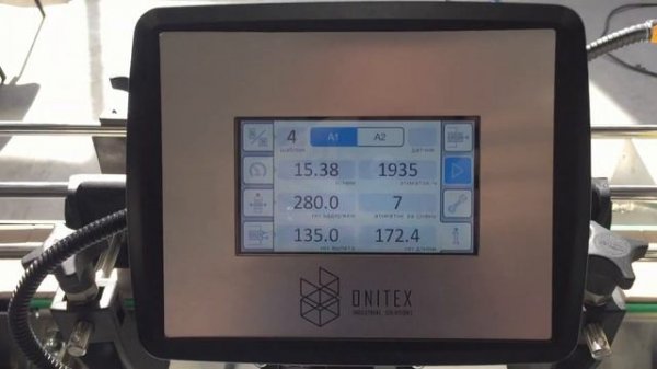 Onitex L100. Labeling of a flimsy and deformed milk bottle with a Wrap-Around label