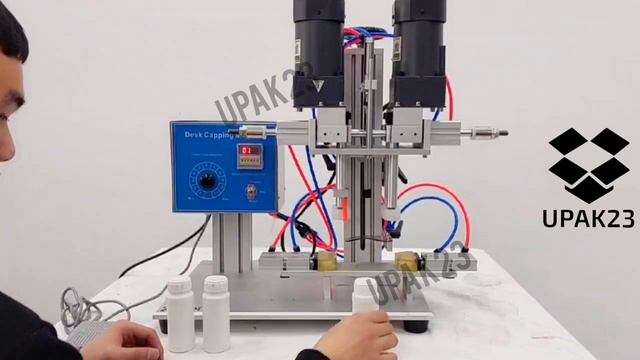 Полуавтоматическая универсальная укупорочная машина XLSGJ-6100 с пневмозажимом для тары смотреть онлайн