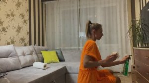 Fit girl Tina in dress cleaning in the home.