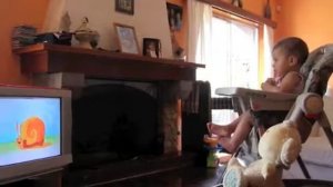 Abby Ann watching her Tiny Love DVD MagIQ