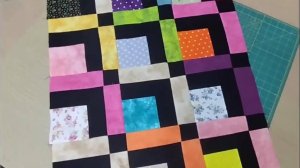 Как сшить потрясающе красивое лоскутное одеяло из разноцветных квадратов и полосок ткани.