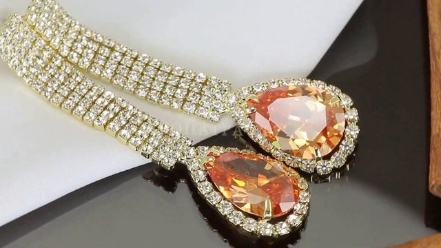 Великолепные серьги с яркими кристаллами Swarovski, покрытые золотом смотреть онлайн