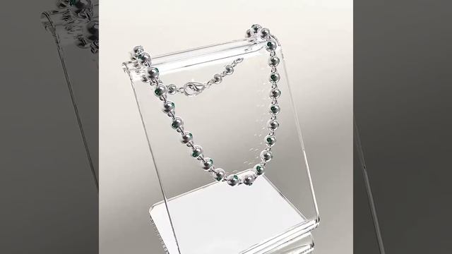 Браслет из литых золотых шариков диаметром 4,5мм из белого золота с изумрудами. смотреть онлайн